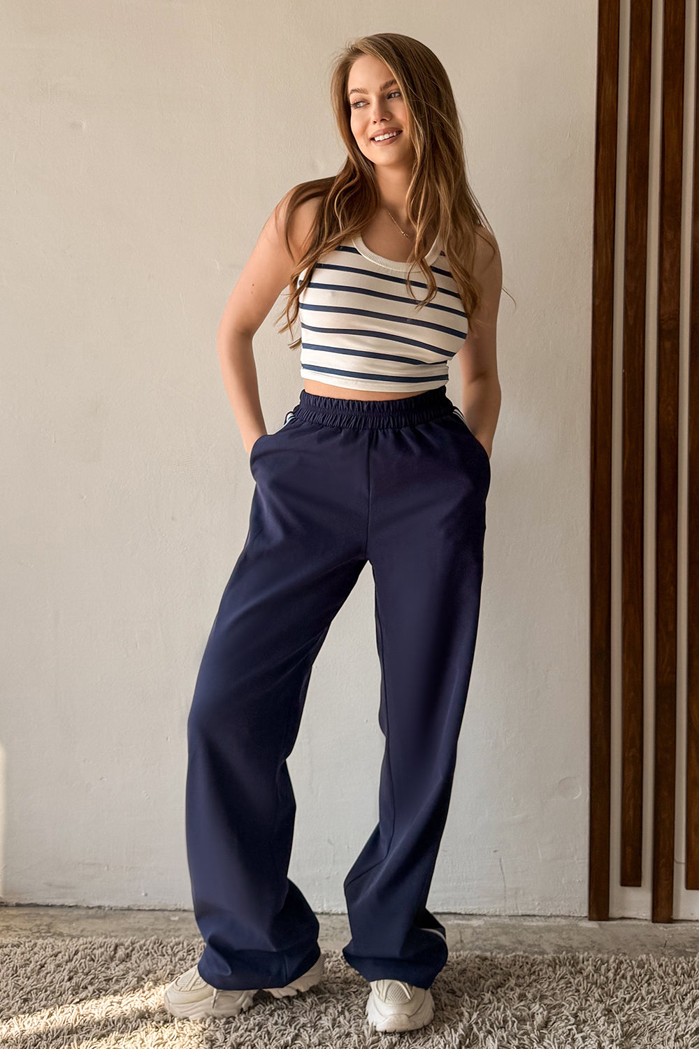 Blue trousers with elastic waistband and stripes