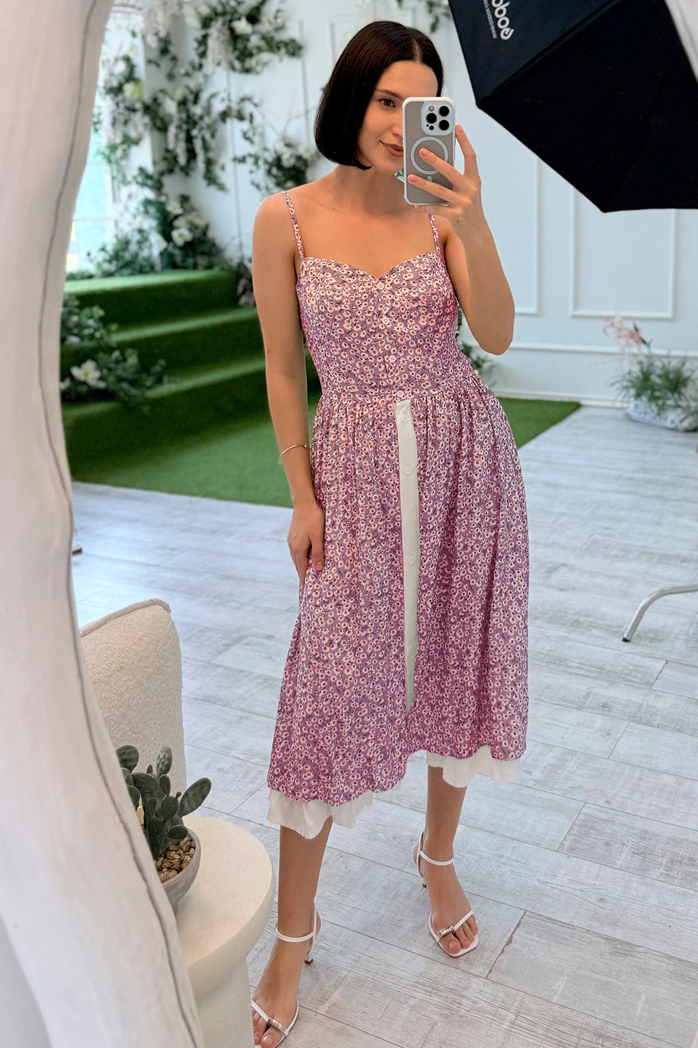 A fringed sundress with straps and a double skirt