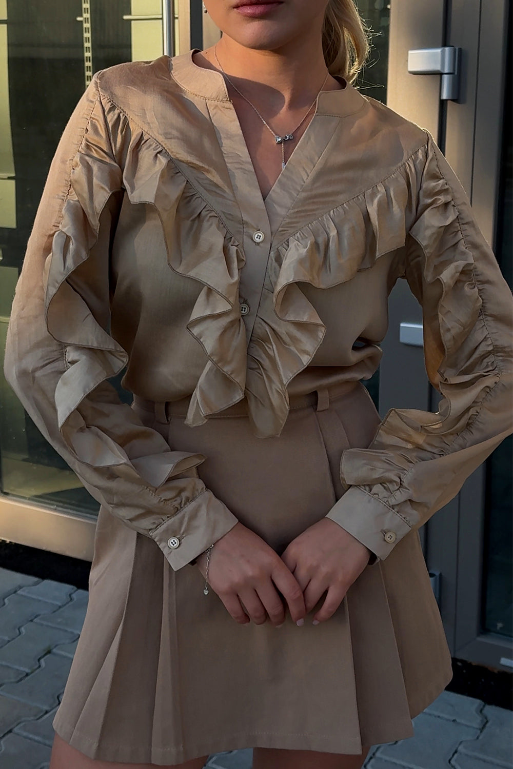 Stylish gold blouse with frills