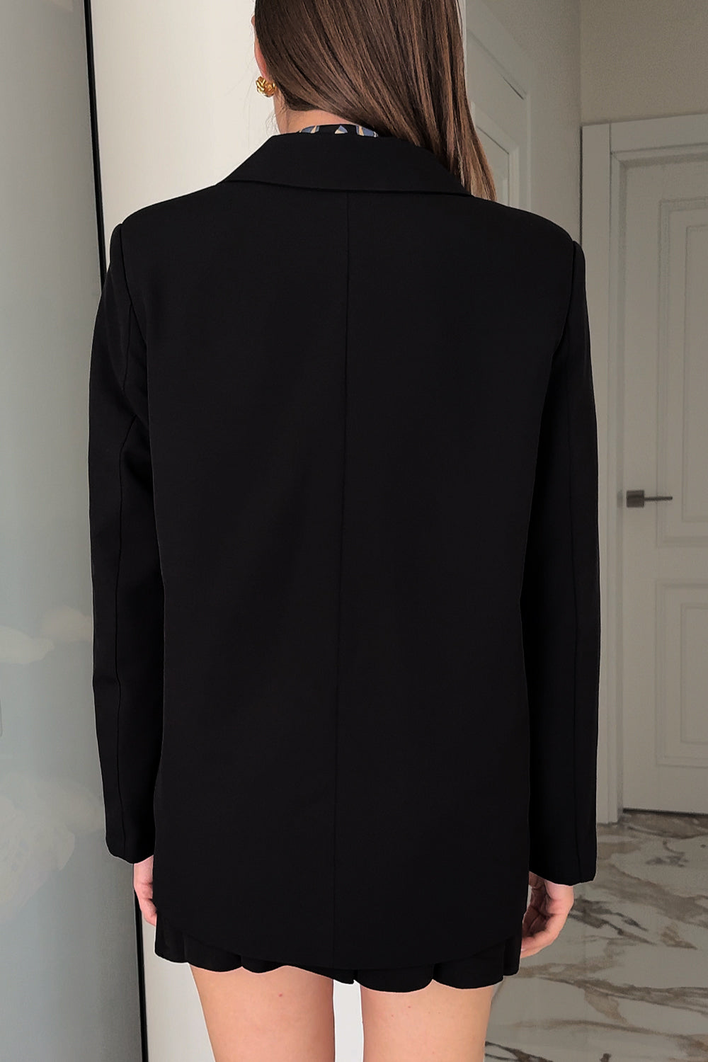 Black double-breasted jacket with a loose silhouette