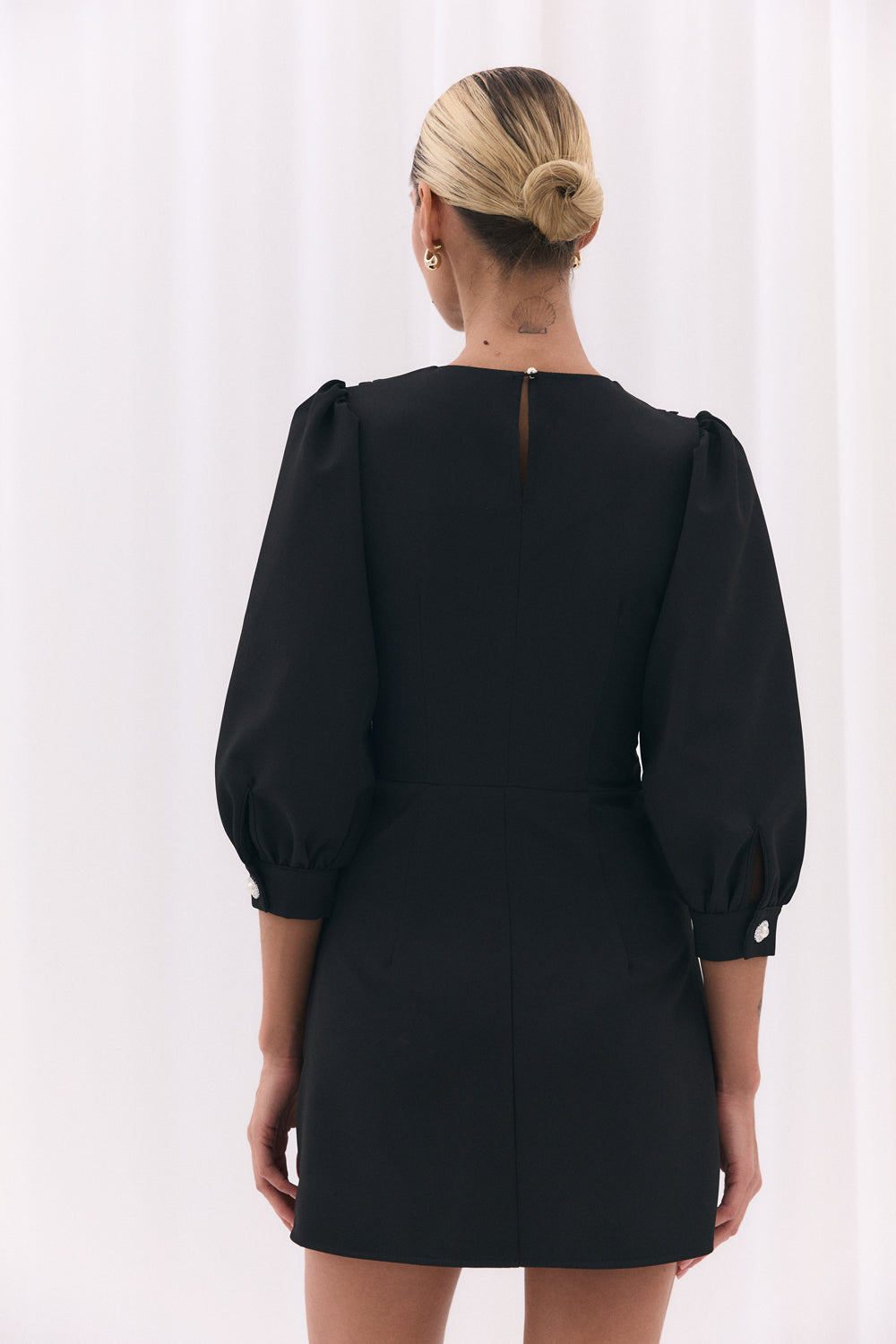 Black fitted dress with a-line skirt and lace collar