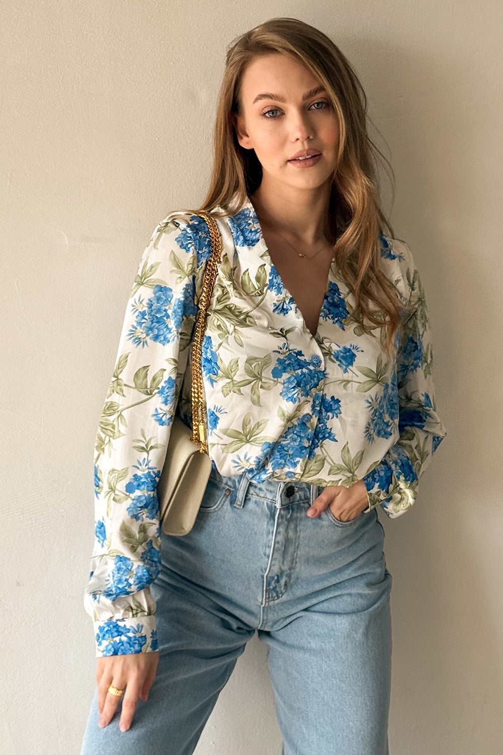 Loose light blue shirt with stand-up collar