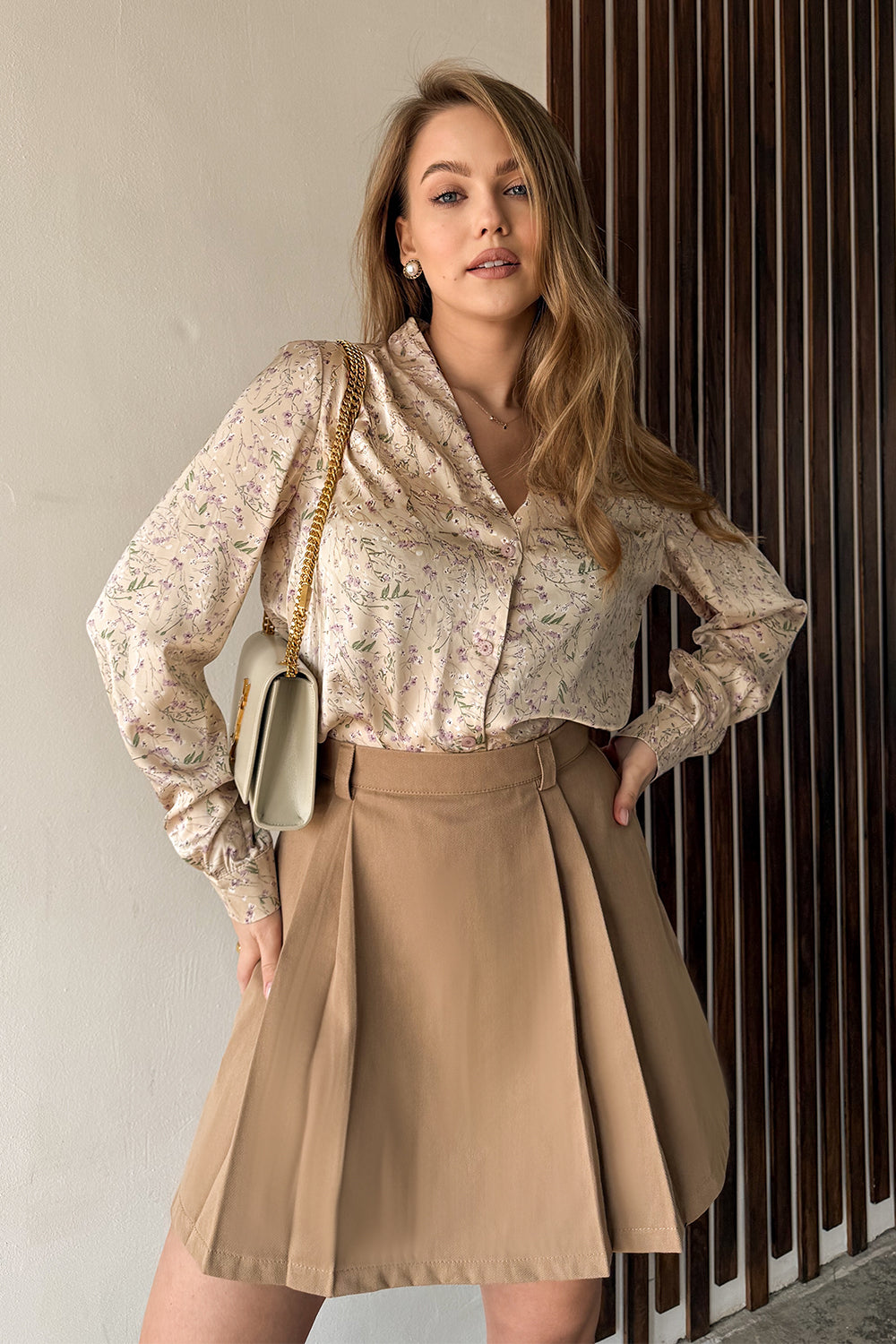 Beige A-line skirt with elegant pleats at the front