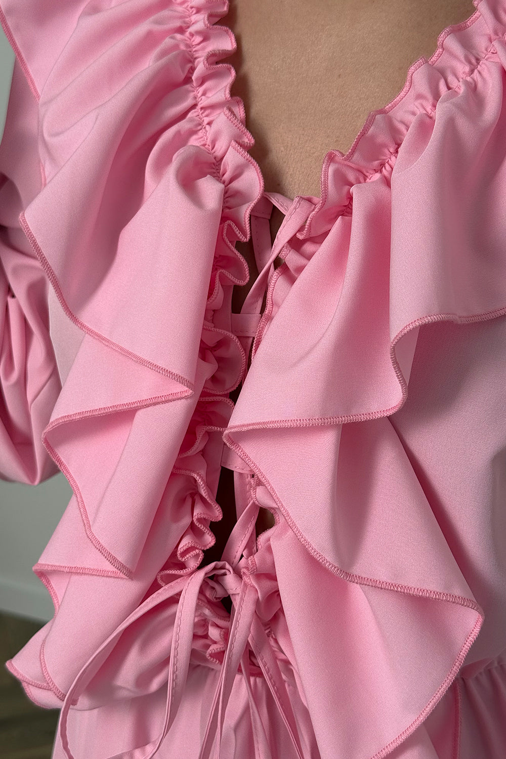 Pink light dress with ruffles