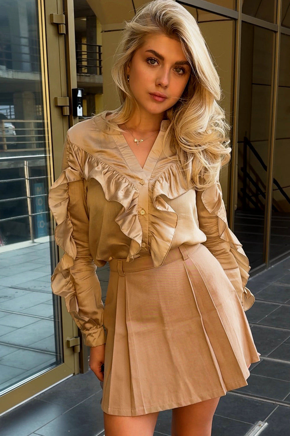 Stylish gold blouse with frills