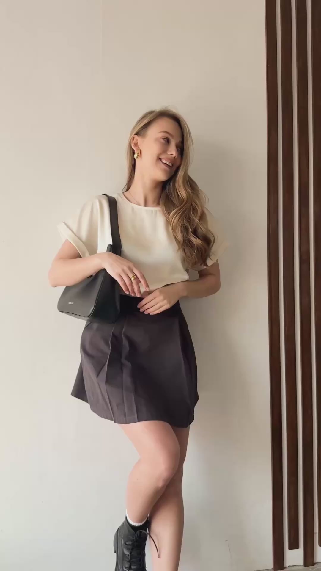 Video showcasing AZURI's silk loose top with one-piece sleeves, elegant cuffs, and luxurious drape